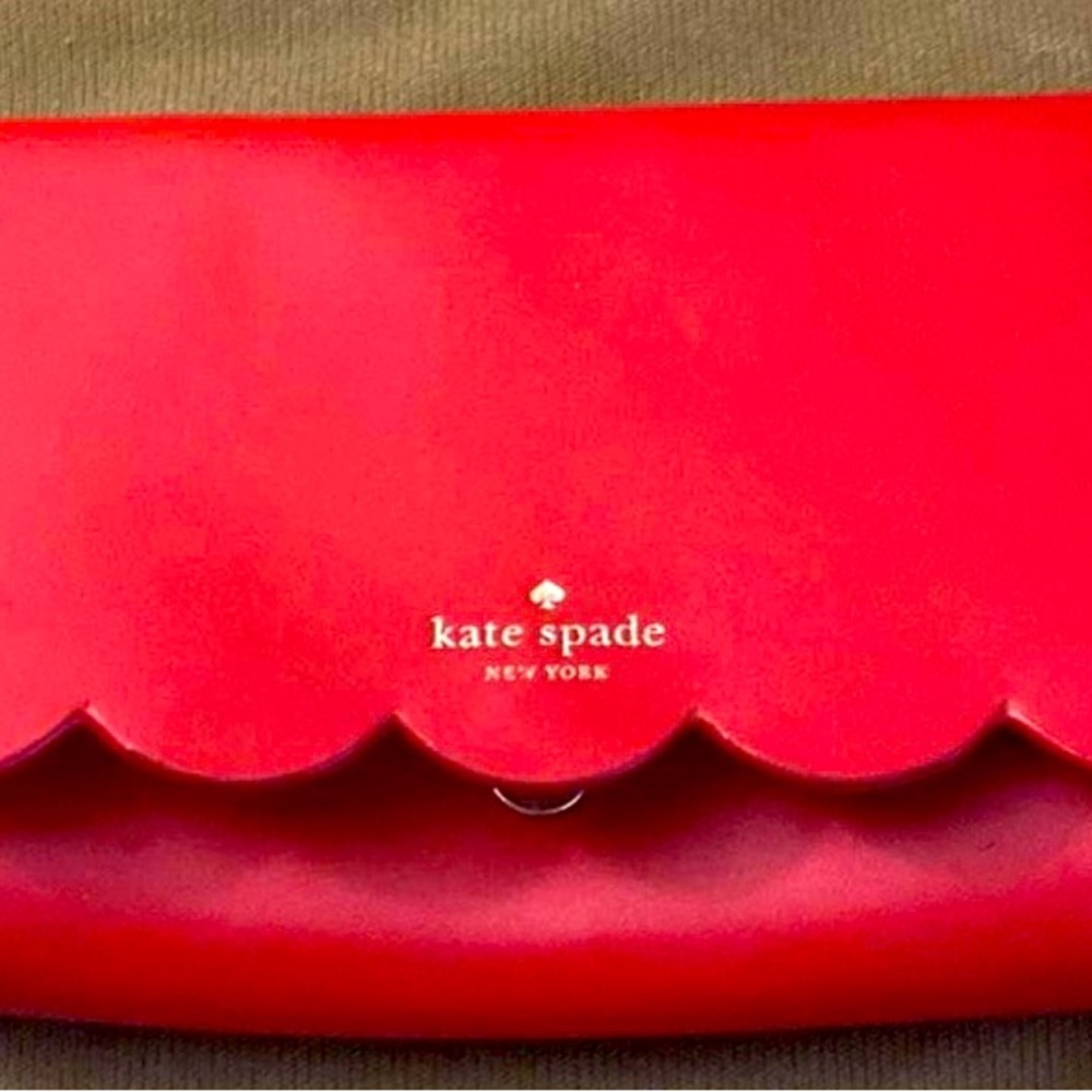 NWOT! Red Kate Spade crossbody, tan interior. Mint condition. Retail $159+
